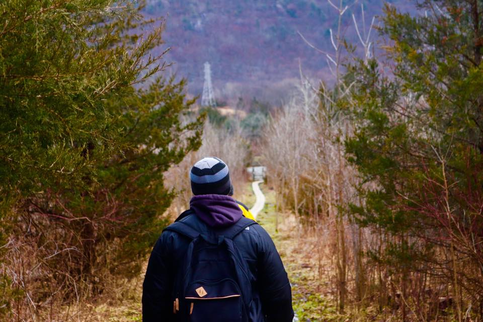 man walking nature path - sober living home in nj concept image