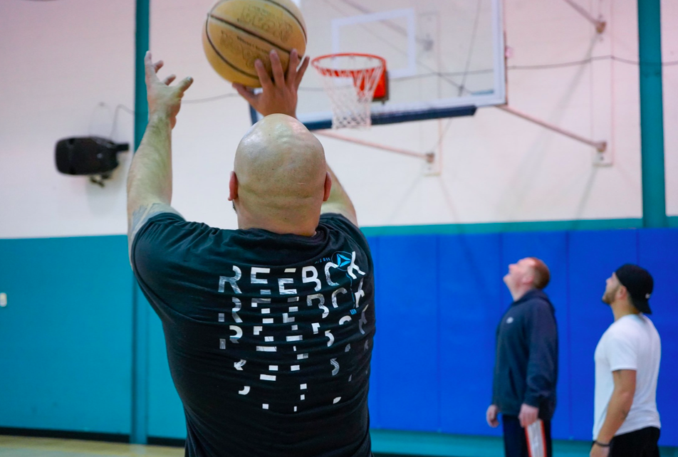 man shooting basketball - recovery house NJ concept