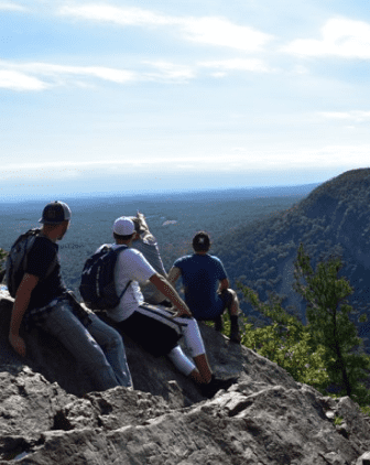 group of hikers enjoying view - men's extended care program